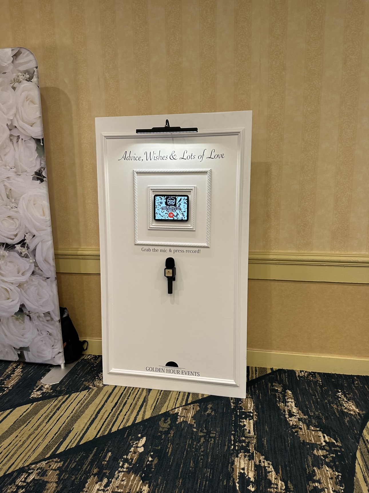 White Golden Hour Events video guestbook station with a screen and microphone